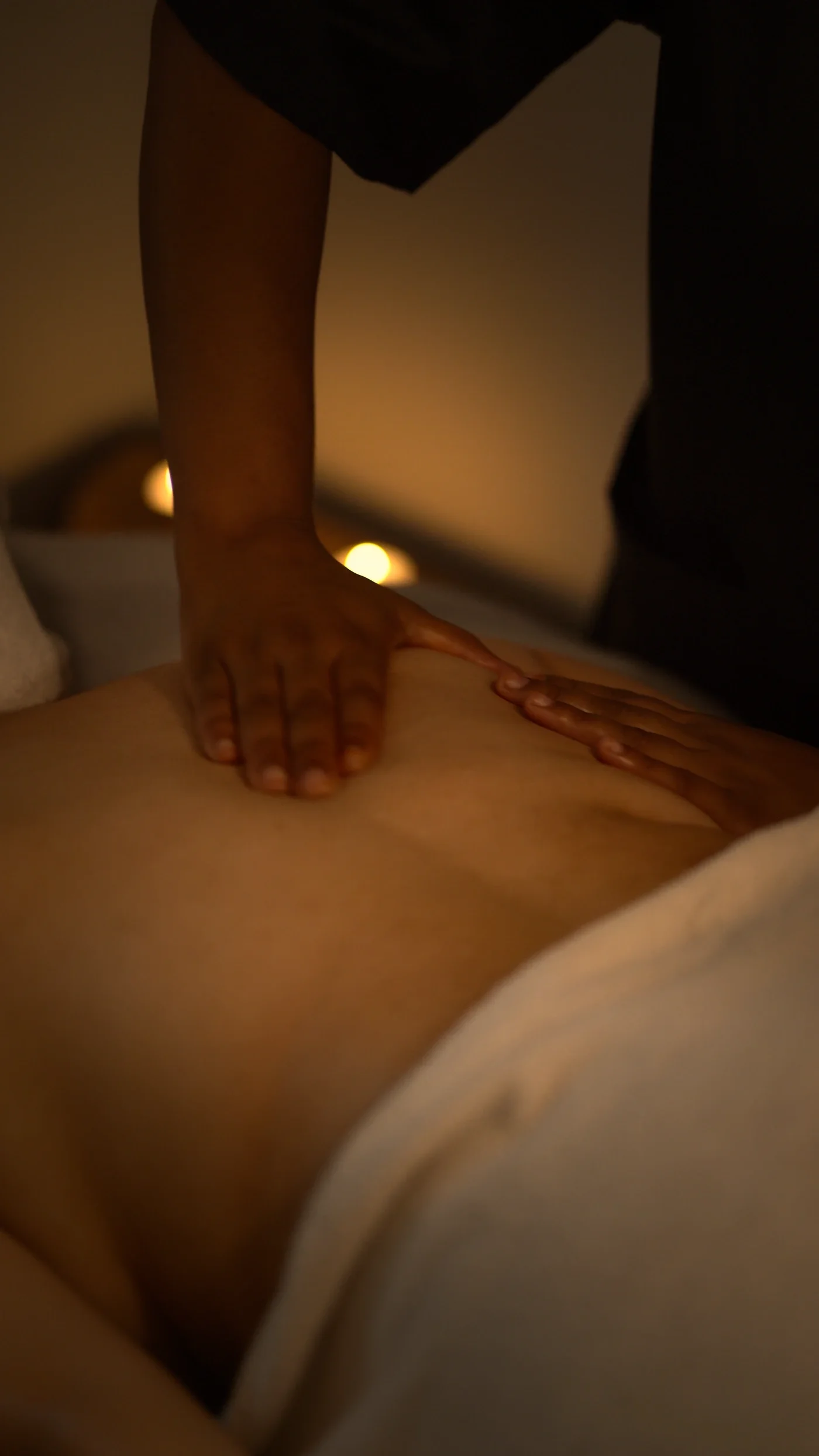 Therapist performing a head and shoulder massage