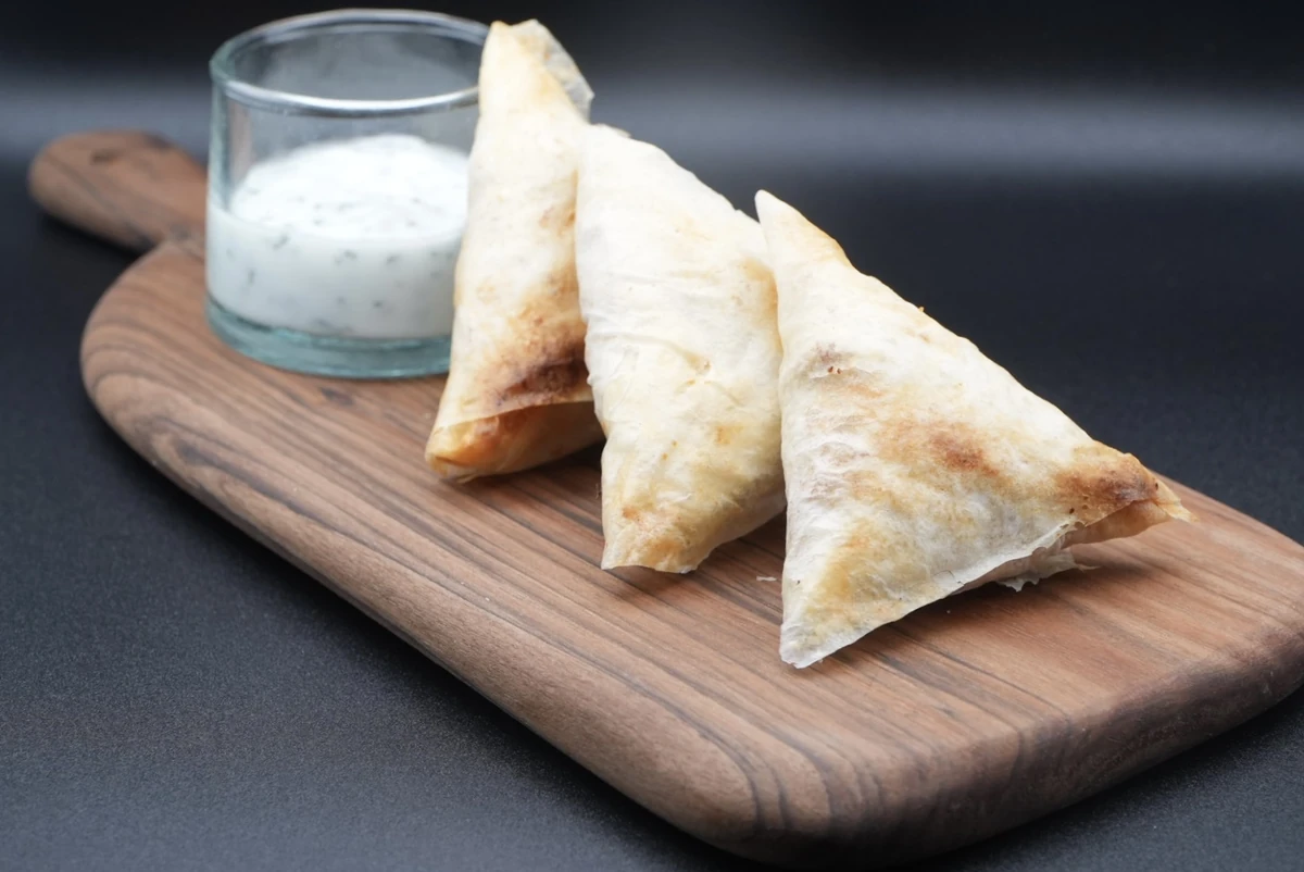 Spiced kefta briuats with fresh mint yogurt sauce